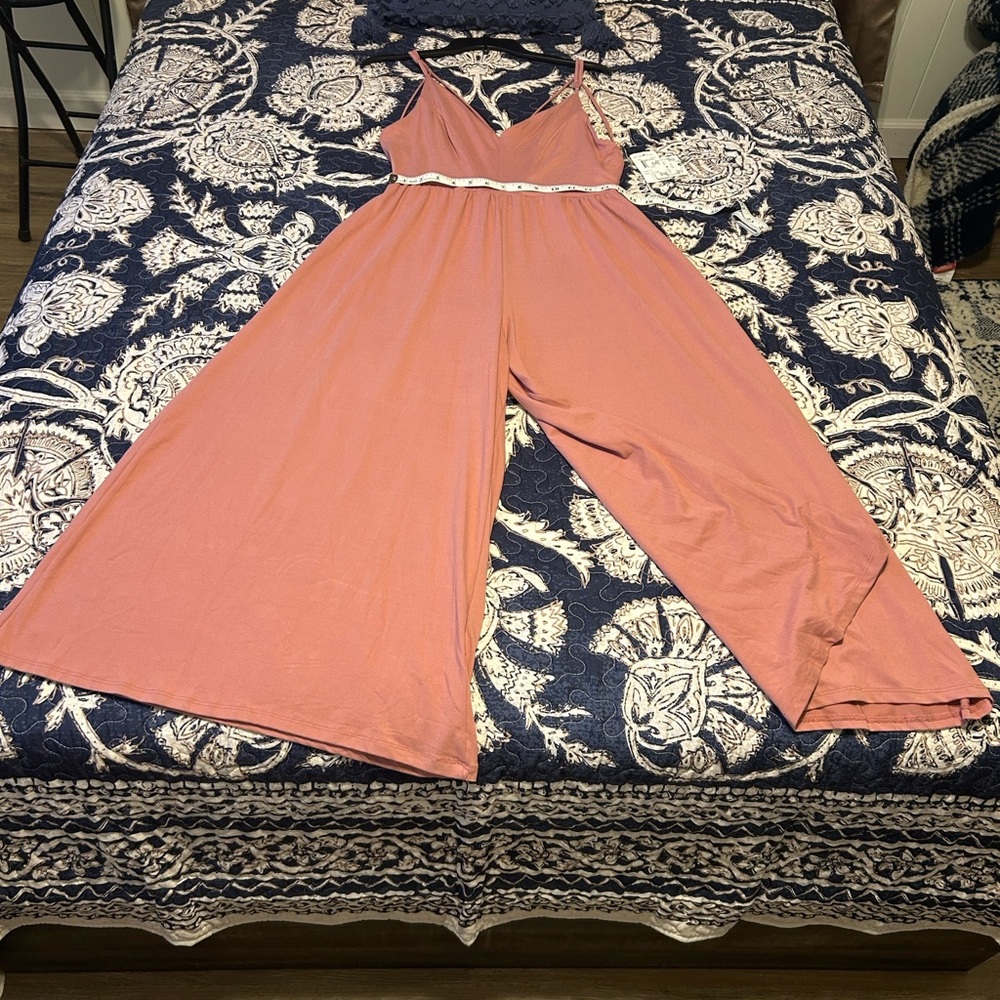Elegant Coral Jumpsuit with tee straps back out.